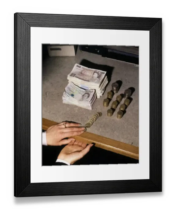 Framed Print : Hands counting money, notes and coins Framed Print : Hands counting money, notes and coins