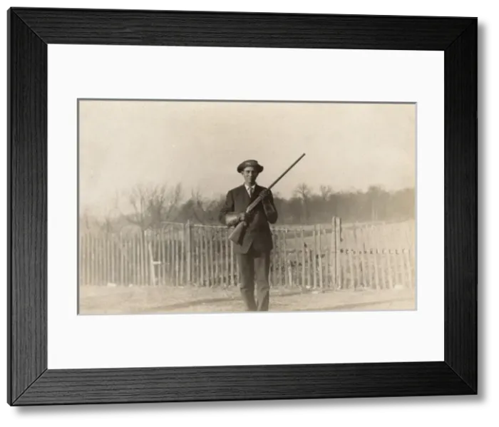 Framed Print : Man posing with rifle Framed Print : Man posing with rifle