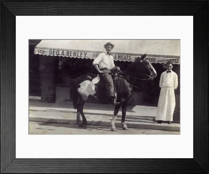Framed Print : Man on horseback outside a shop, USA Framed Print : Man on horseback outside a shop, USA