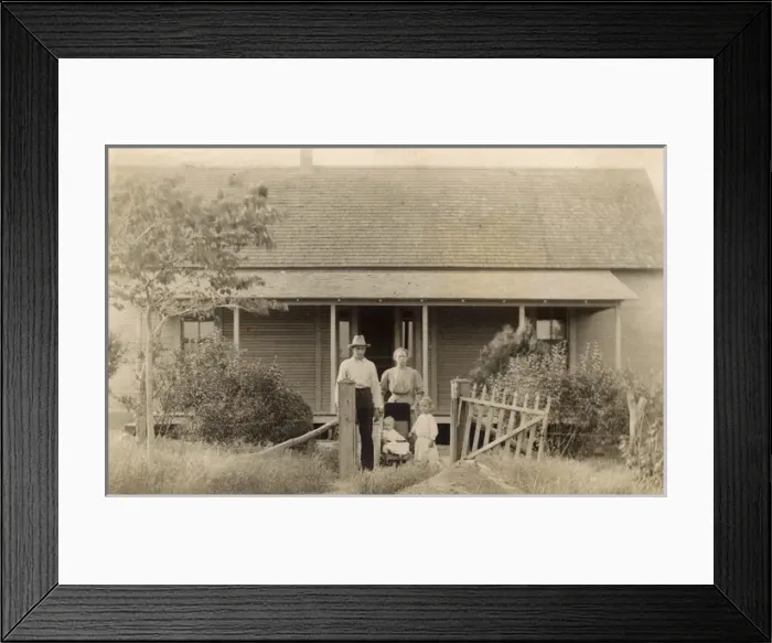 Framed Print : Family of four outside their bungalow-style cabin, USA Framed Print : Family of four outside their bungalow-style cabin, USA