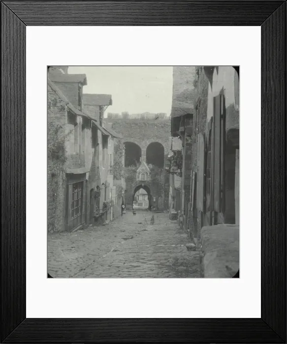 Framed Print : Dinan - black and white view of cobbled street, houses on both sides Date: circa 1890s Framed Print : Dinan - black and white view of cobbled street, houses on both sides Date: circa 1890s