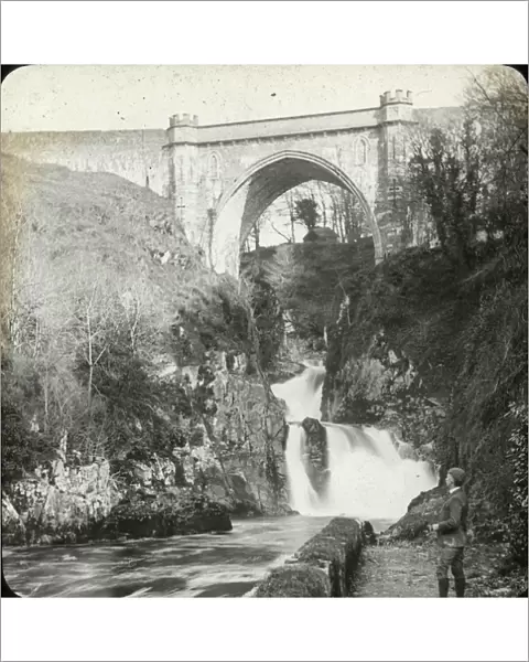 Gothic arch over a picturesque waterfall in Wales