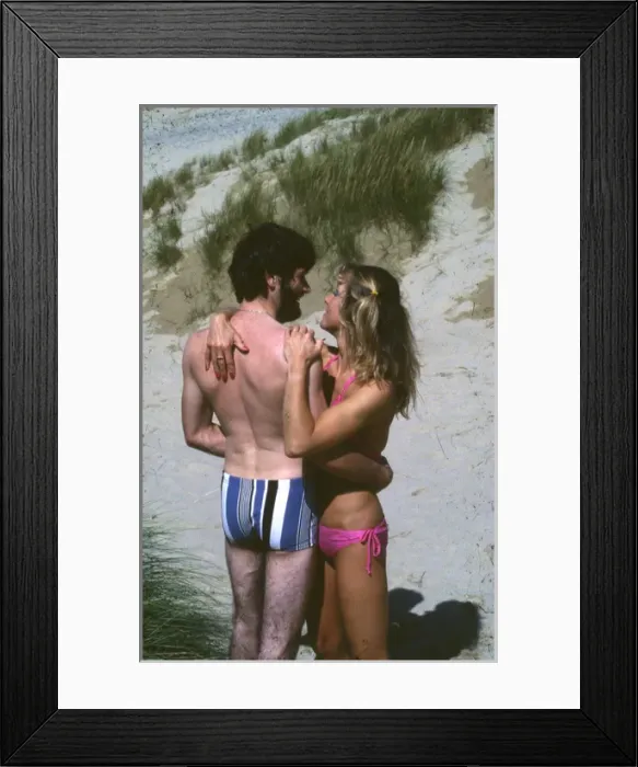 Framed Print : Couple on a beach, West Country Framed Print : Couple on a beach, West Country