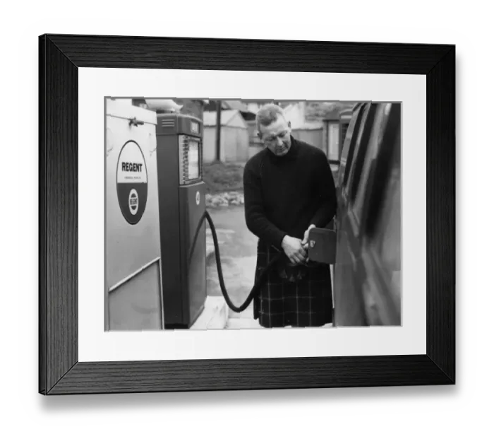 Framed Print : Man in a kilt, filling a van up with petrol Framed Print : Man in a kilt, filling a van up with petrol