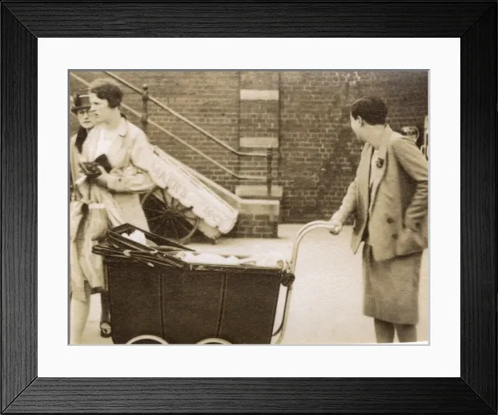 Framed Print : Woman in smart summer suit pushing a perambulator Framed Print : Woman in smart summer suit pushing a perambulator