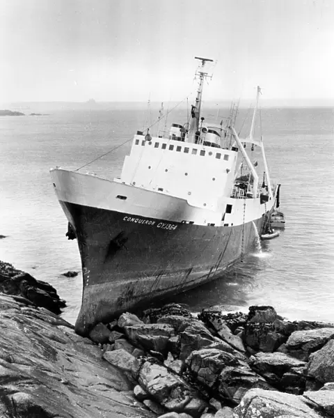 Stern trawler Conqueror on rocks at Mousehole, Cornwall