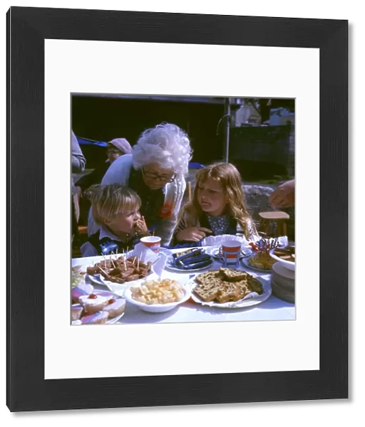 Children and elderly lady at a street party