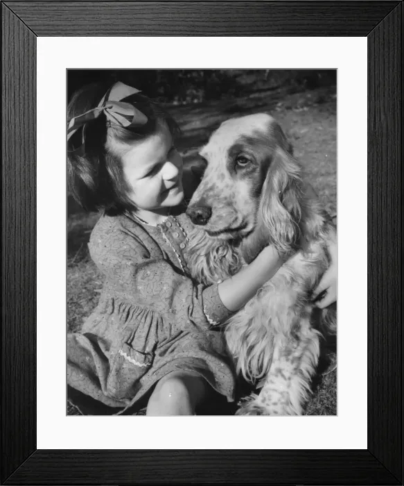 Framed Print : Little girl and dog in the garden Framed Print : Little girl and dog in the garden