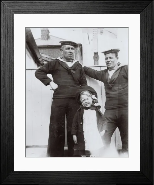 Framed Print : Two coastguards and a little girl Framed Print : Two coastguards and a little girl