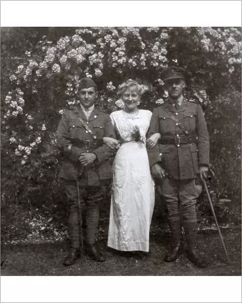 Mother and two sons in a garden, WW1