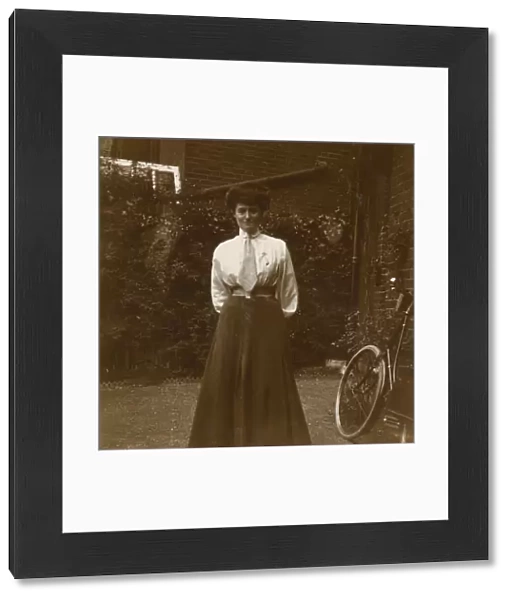 Young Edwardian woman in a garden