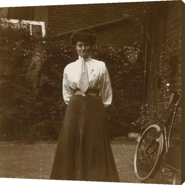 Young Edwardian woman in a garden