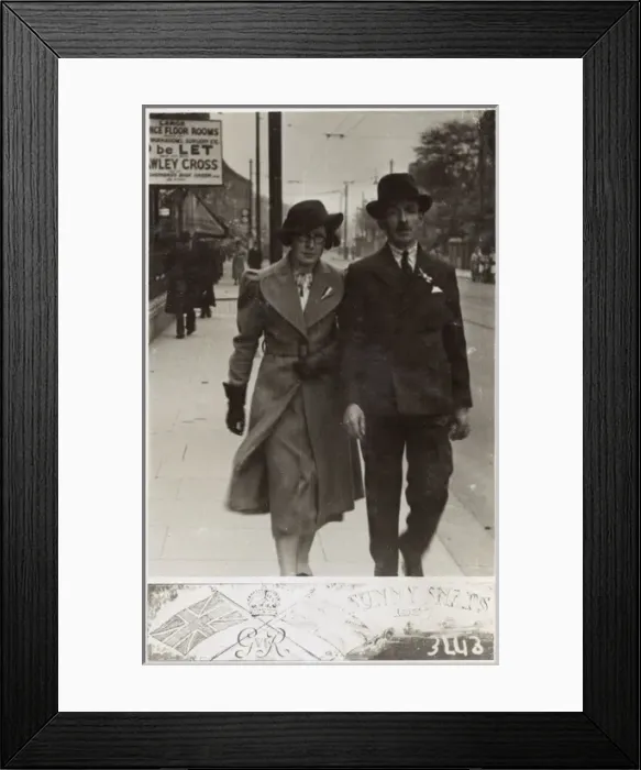 Framed Print : Gent and his daughter stroll down a London street Framed Print : Gent and his daughter stroll down a London street