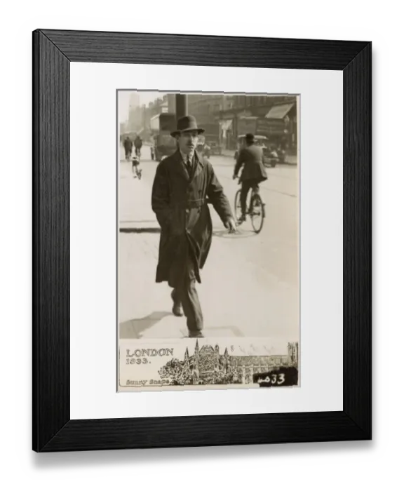 Framed Print : Gent in Raincoat and trilby hat strides along London street Framed Print : Gent in Raincoat and trilby hat strides along London street