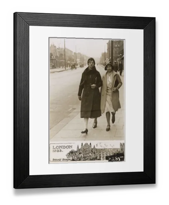 Framed Print : A stern pair of Ladies stride down a London Street Framed Print : A stern pair of Ladies stride down a London Street