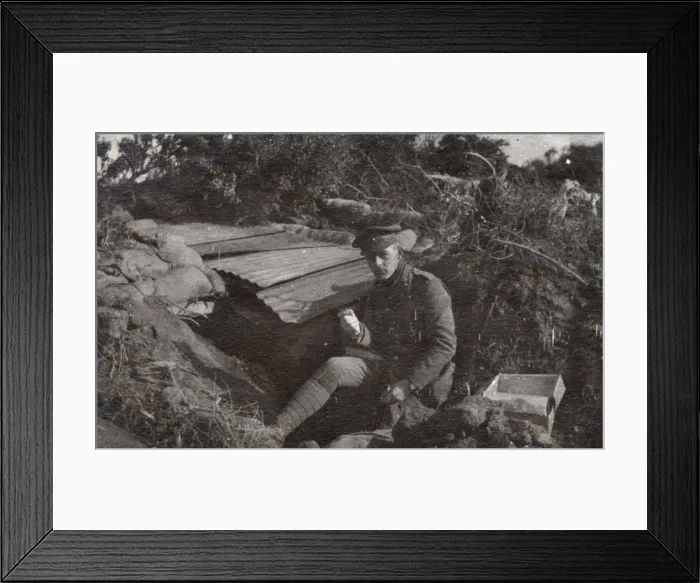 Framed Print : Soldier sitting by a dugout, Northern France, WW1 Framed Print : Soldier sitting by a dugout, Northern France, WW1