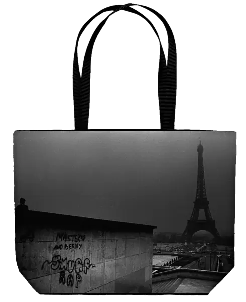 Eiffel Tower with grafitti, Paris, France