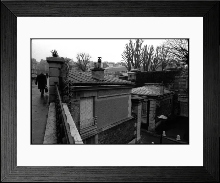 Framed Print : Figure walking outside Paris cemetery, France Framed Print : Figure walking outside Paris cemetery, France