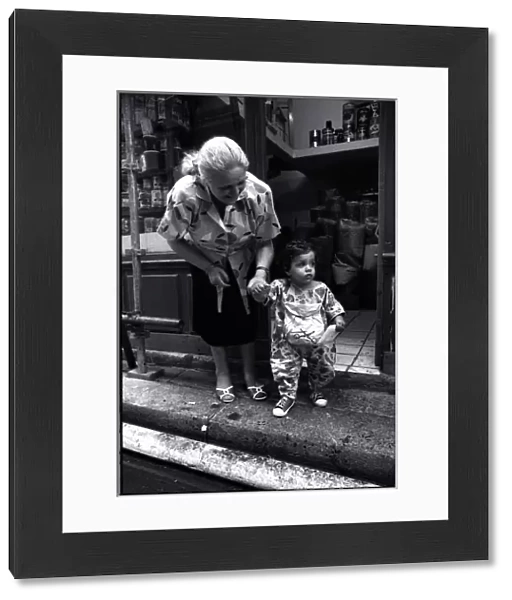 Woman and child outside shop, Paris, France