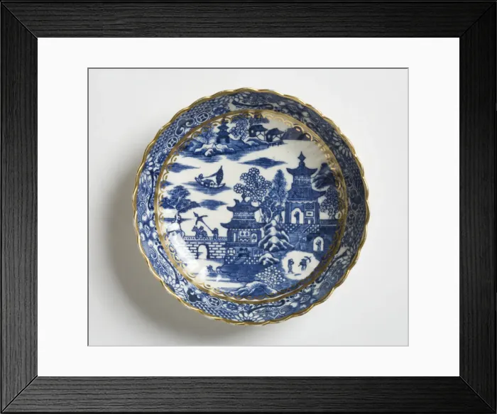 Framed Print : Saucer made from porcelain, transfer-printed in underglaze blue with the Framed Print : Saucer made from porcelain, transfer-printed in underglaze blue with the