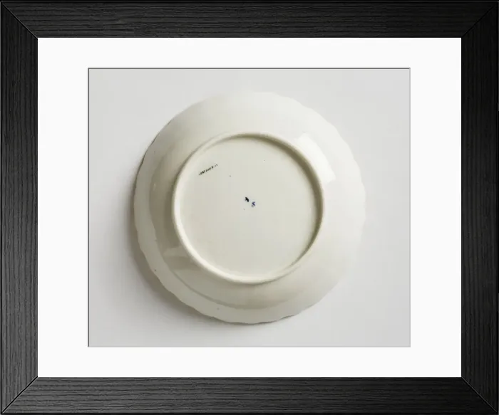 Framed Print : Saucer made from porcelain, transfer-printed in underglaze blue with the Framed Print : Saucer made from porcelain, transfer-printed in underglaze blue with the
