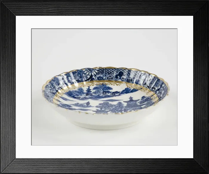 Framed Print : Saucer made from porcelain, transfer-printed in underglaze blue with the Framed Print : Saucer made from porcelain, transfer-printed in underglaze blue with the