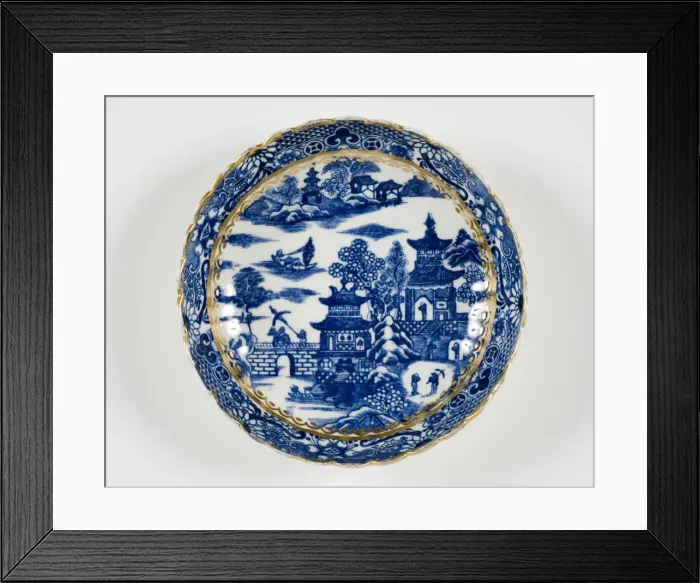 Framed Print : Saucer made from porcelain, transfer-printed in underglaze blue with the Framed Print : Saucer made from porcelain, transfer-printed in underglaze blue with the