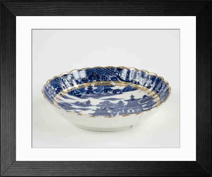 Framed Print : Saucer made from porcelain, transfer-printed in underglaze blue with the Framed Print : Saucer made from porcelain, transfer-printed in underglaze blue with the