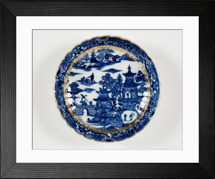Framed Print : Saucer made from porcelain, transfer-printed in underglaze blue with the Framed Print : Saucer made from porcelain, transfer-printed in underglaze blue with the