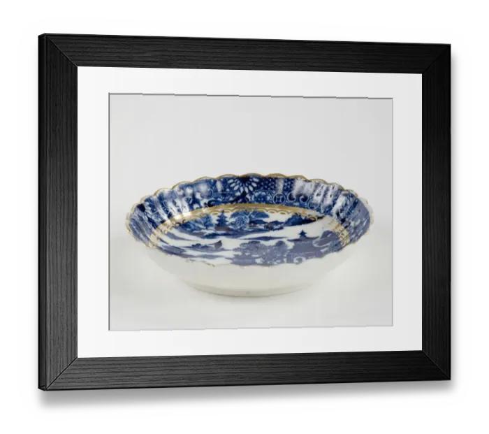 Framed Print : Saucer made from porcelain, transfer-printed in underglaze blue with the Framed Print : Saucer made from porcelain, transfer-printed in underglaze blue with the
