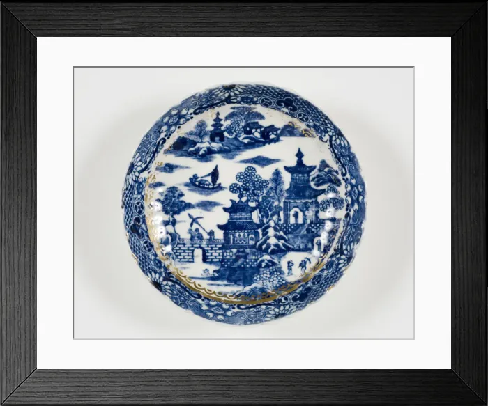 Framed Print : Saucer made from porcelain, transfer-printed in underglaze blue with the Framed Print : Saucer made from porcelain, transfer-printed in underglaze blue with the