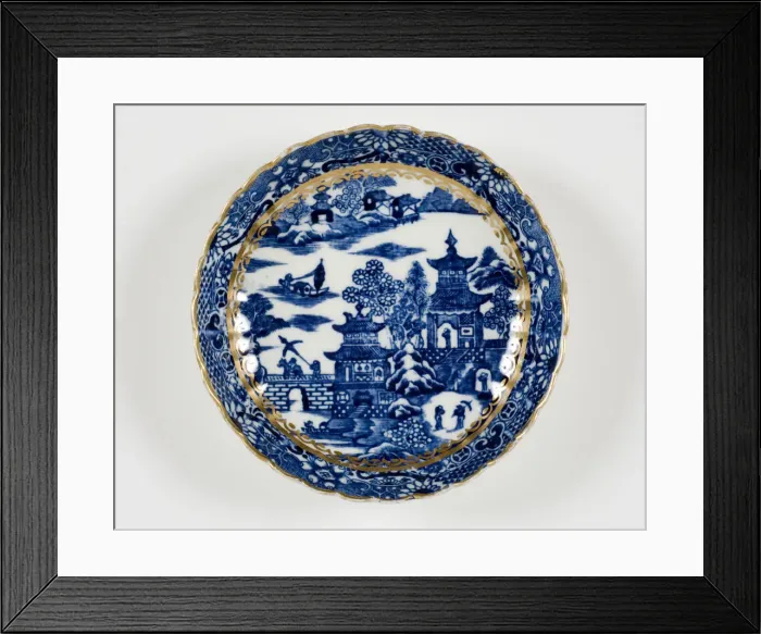 Framed Print : Saucer made from porcelain, transfer-printed in underglaze blue with the Framed Print : Saucer made from porcelain, transfer-printed in underglaze blue with the