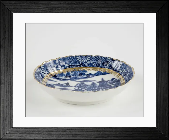 Framed Print : Saucer made from porcelain, transfer-printed in underglaze blue with the Framed Print : Saucer made from porcelain, transfer-printed in underglaze blue with the