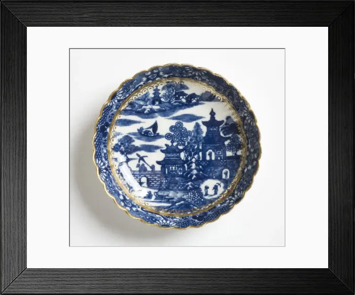 Framed Print : Saucer made from porcelain, transfer-printed in underglaze blue with the Framed Print : Saucer made from porcelain, transfer-printed in underglaze blue with the