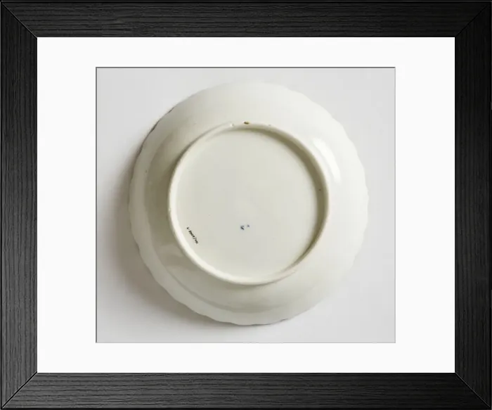 Framed Print : Saucer made from porcelain, transfer-printed in underglaze blue with the Framed Print : Saucer made from porcelain, transfer-printed in underglaze blue with the