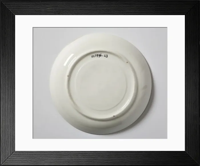 Framed Print : Saucer made from glazed hard-paste porcelain, decorated with a transfer-printed Framed Print : Saucer made from glazed hard-paste porcelain, decorated with a transfer-printed