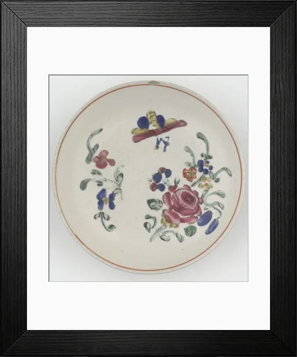 Framed Print : Saucer. Salt-glazed stoneware saucer, with overglaze enamel decoration of flowers in pink Framed Print : Saucer. Salt-glazed stoneware saucer, with overglaze enamel decoration of flowers in pink