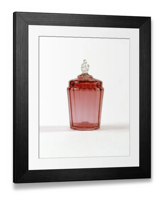 Framed Print : Jar. Cranberry-coloured glass jar with a ribbed interior Framed Print : Jar. Cranberry-coloured glass jar with a ribbed interior