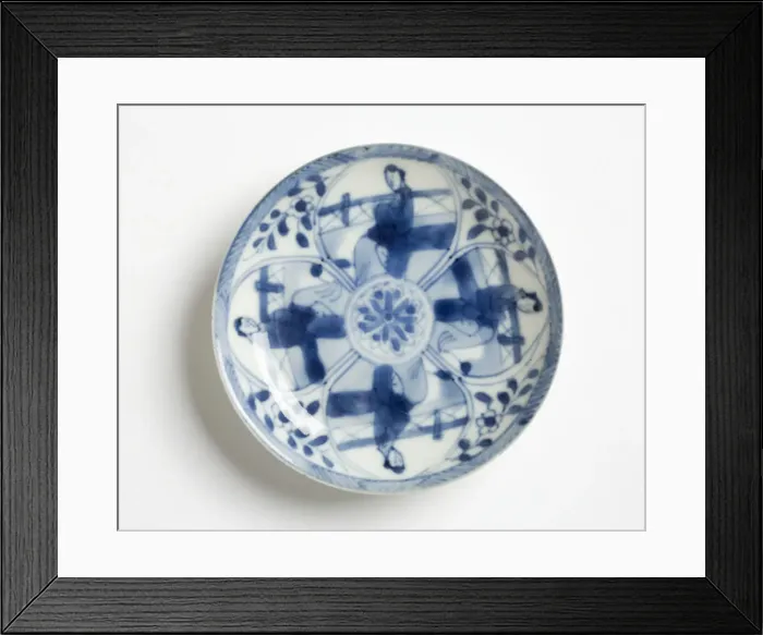 Framed Print : Saucer. Porcelain saucer decorated in underglaze blue with four petal-shaped Framed Print : Saucer. Porcelain saucer decorated in underglaze blue with four petal-shaped