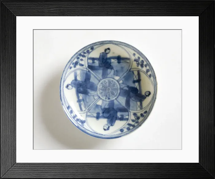 Framed Print : Saucer. Porcelain saucer decorated in underglaze blue with four petal-shaped Framed Print : Saucer. Porcelain saucer decorated in underglaze blue with four petal-shaped