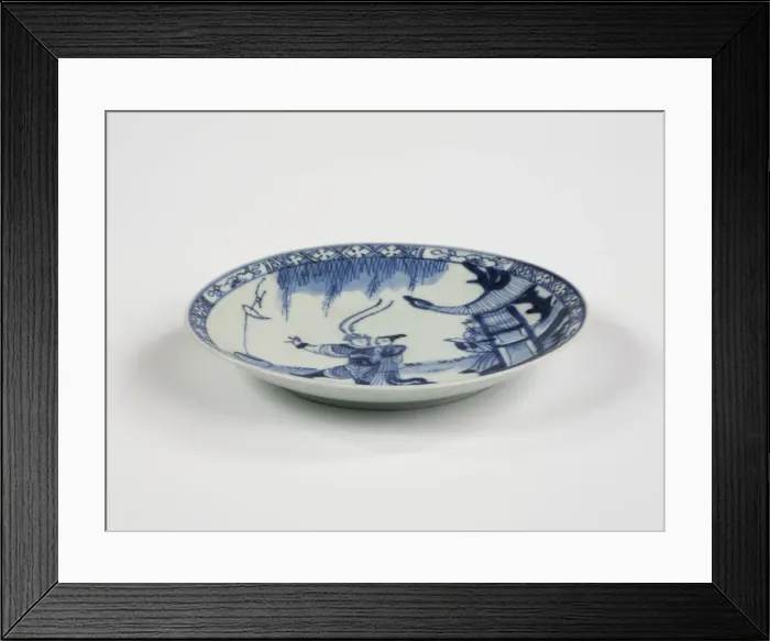 Framed Print : Saucer. Porcelain saucer with cobalt blue underglaze decoration of three figures Framed Print : Saucer. Porcelain saucer with cobalt blue underglaze decoration of three figures