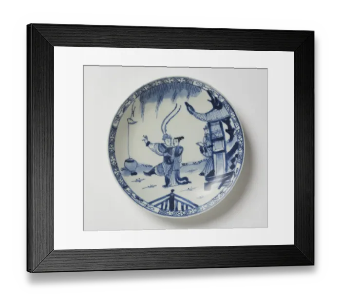 Framed Print : Saucer. Porcelain saucer with cobalt blue underglaze decoration of three figures Framed Print : Saucer. Porcelain saucer with cobalt blue underglaze decoration of three figures