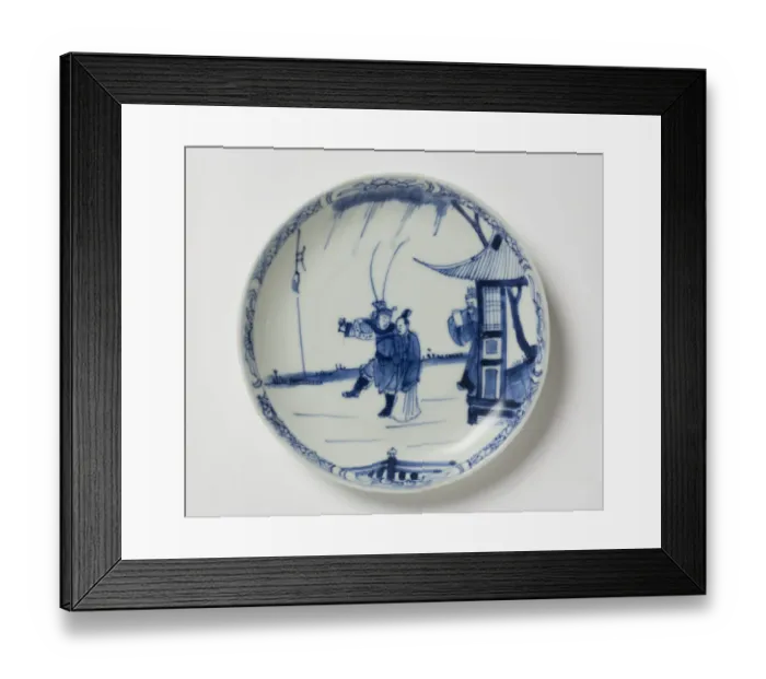 Framed Print : Saucer. Porcelain saucer with cobalt blue underglaze decoration of three figures