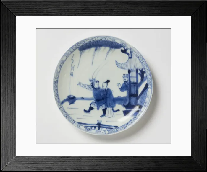 Framed Print : Saucer. Porcelain saucer with cobalt blue underglaze decoration of three figures Framed Print : Saucer. Porcelain saucer with cobalt blue underglaze decoration of three figures