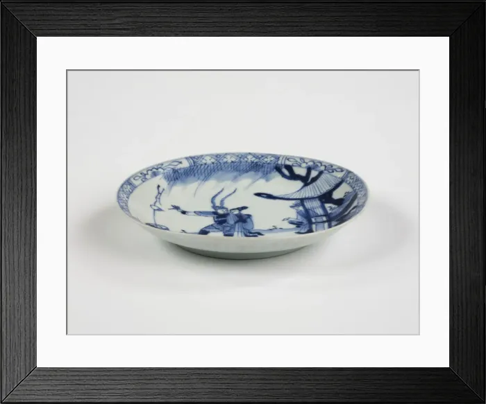 Framed Print : Saucer. Porcelain saucer with cobalt blue underglaze decoration of three figures Framed Print : Saucer. Porcelain saucer with cobalt blue underglaze decoration of three figures