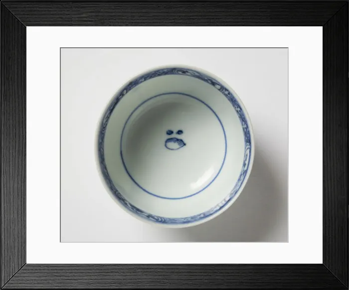 Framed Print : Tea bowl. Porcelain tea bowl with cobalt blue underglaze decoration of three figures Framed Print : Tea bowl. Porcelain tea bowl with cobalt blue underglaze decoration of three figures