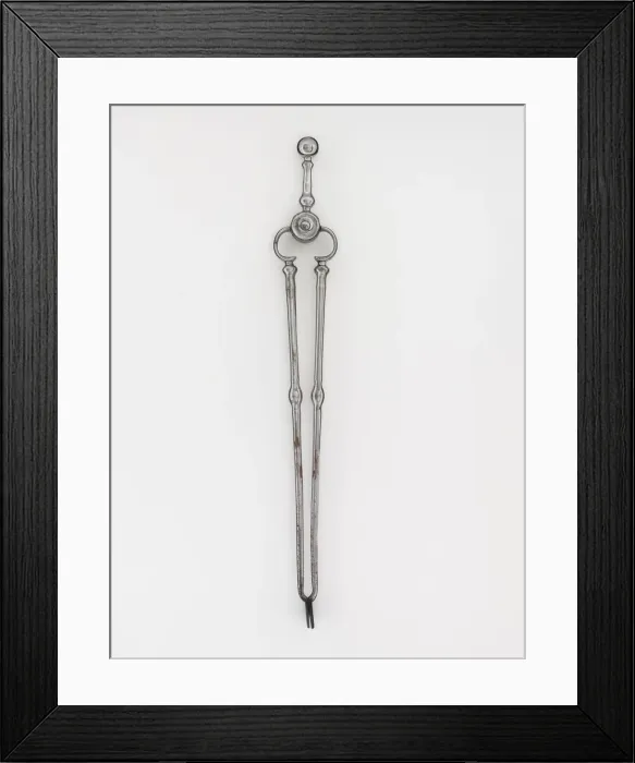 Framed Print : Tongs. Steel tongs, from a set of fire irons, with shafts with baluster Framed Print : Tongs. Steel tongs, from a set of fire irons, with shafts with baluster