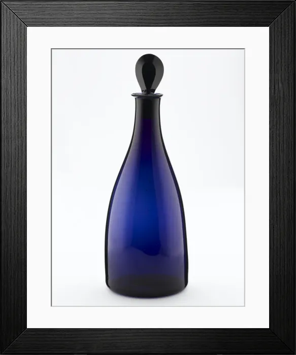 Framed Print : Decanter of tapered form made from blown and bevelled blue glass Framed Print : Decanter of tapered form made from blown and bevelled blue glass