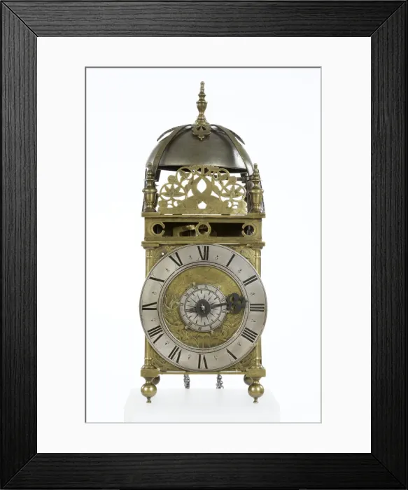Framed Print : Clock. Brass and metal lantern clock on four ball feet Framed Print : Clock. Brass and metal lantern clock on four ball feet