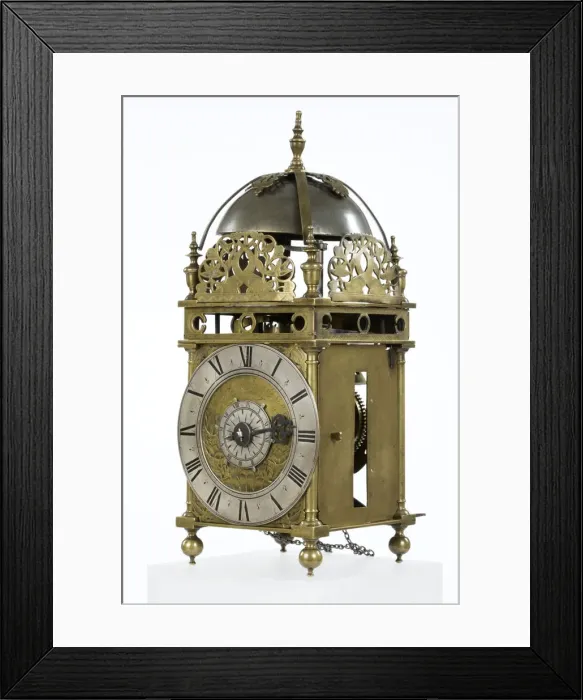 Framed Print : Clock. Brass and metal lantern clock on four ball feet Framed Print : Clock. Brass and metal lantern clock on four ball feet